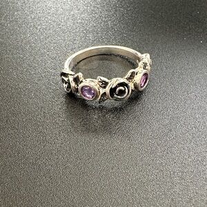 Silver and Purple Gemstone Ring with Flower Patterns